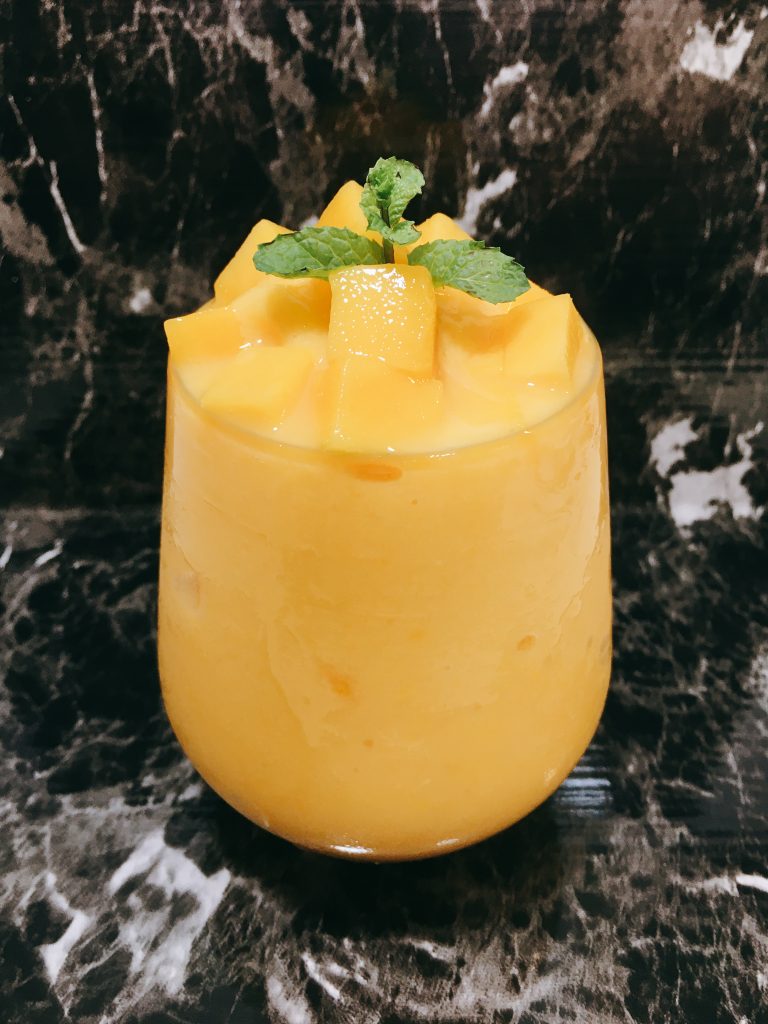 Serve the mango yogurt smoothie.