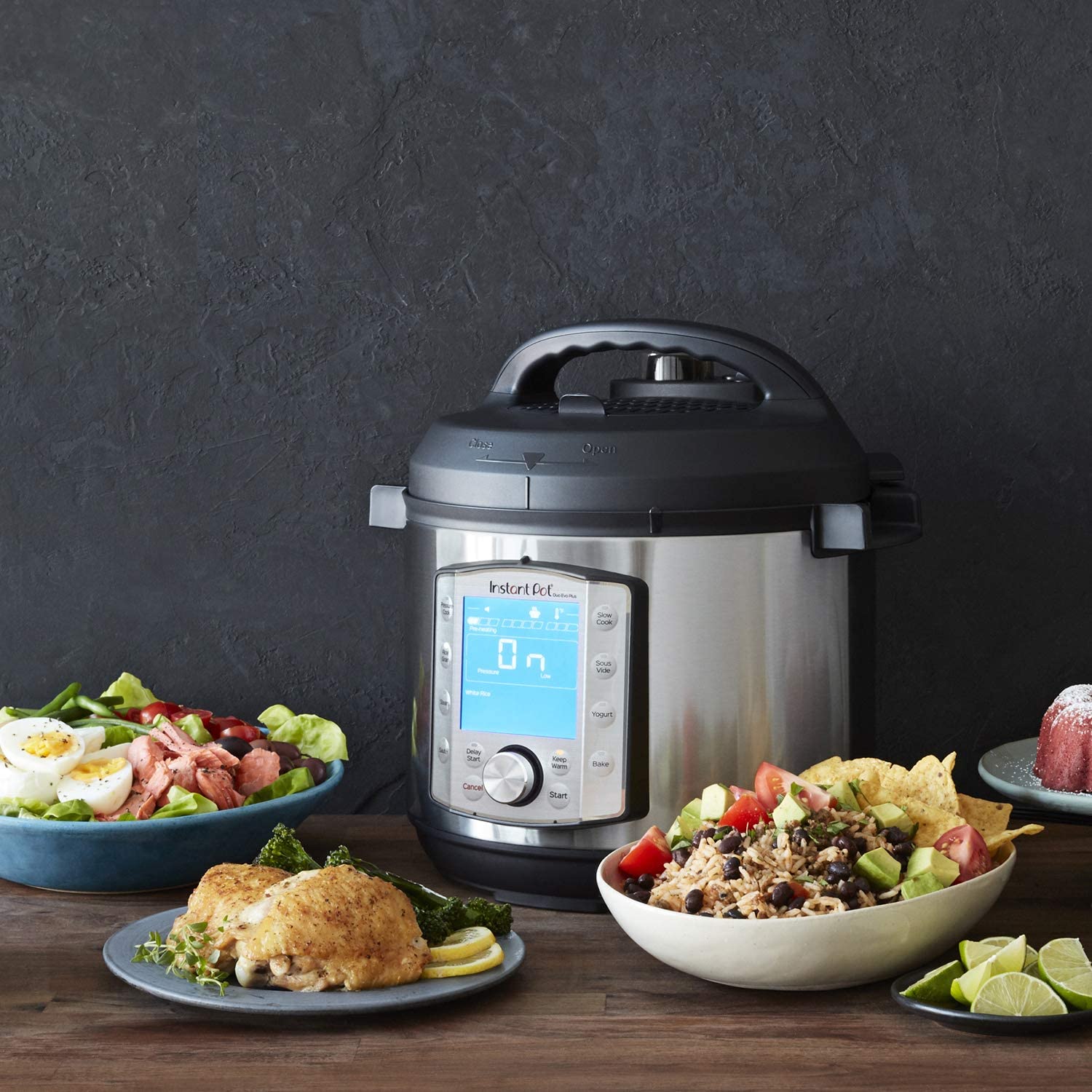 Instant Pot Duo Evo Plus Pressure Cooker with dishes